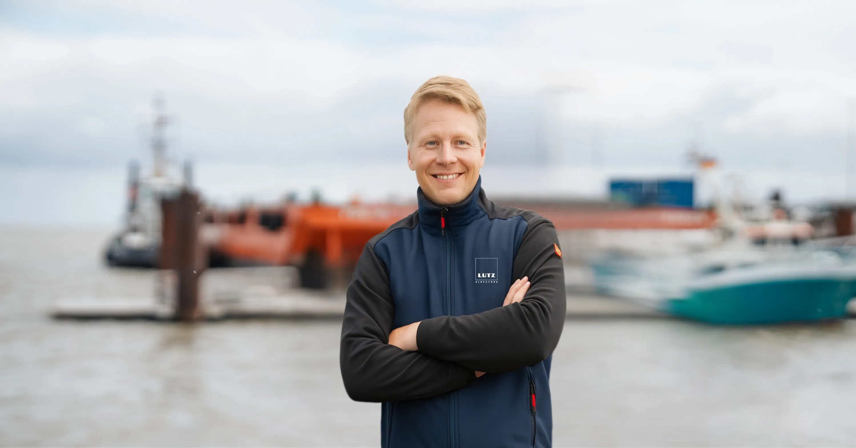 Technician in front of a harbour
